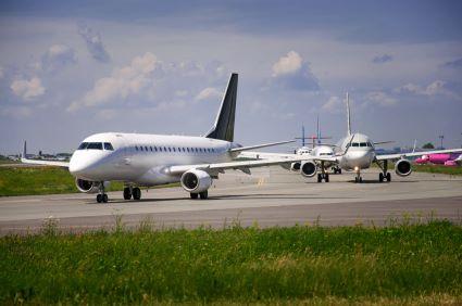 An image of aircraft lining up for takeoff at an airport. 